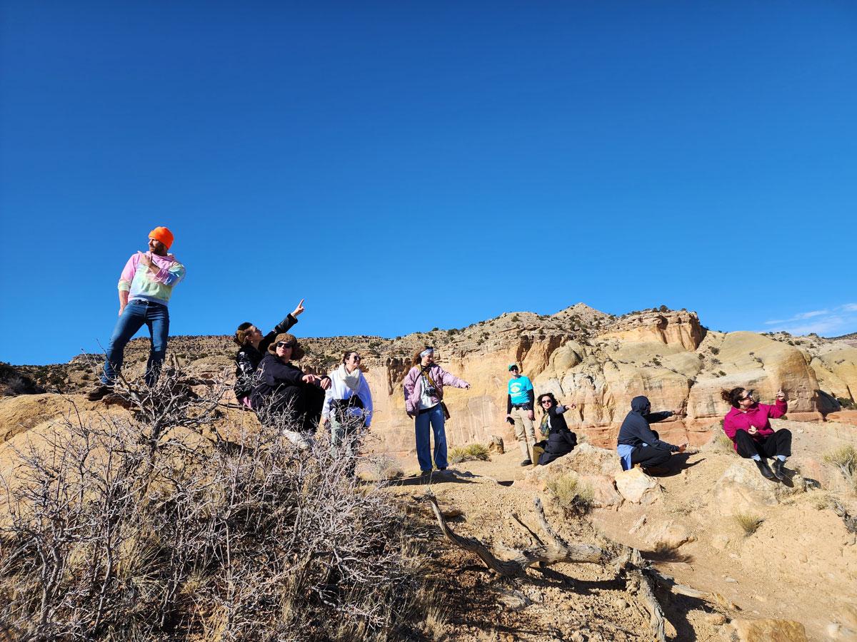 Students pointing at rock formations in Santa Fe
