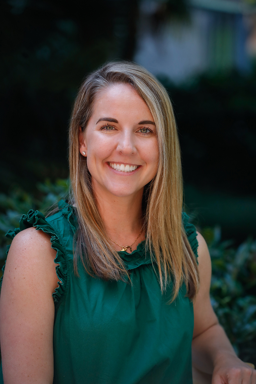 Portrait of Krista Glaser, NP wearing a green blouse and gently smiling