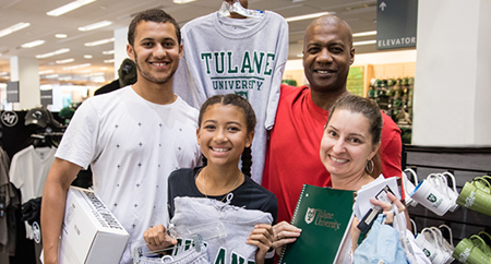 Tulane student exploring the bookstore with his family