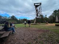 Students looking at outdoor obstacle course