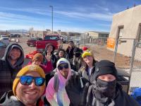 Group photos of TRC members on Sober Ski Trip Mardi Gras 2023 in Santa Fe Group selfie of TRC members outside in Santa Fe