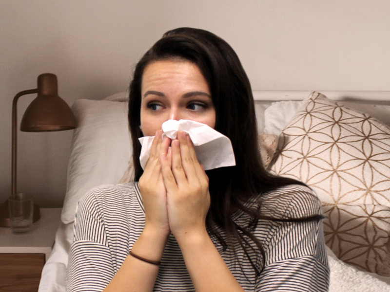 A sick Tulane student blows her nose