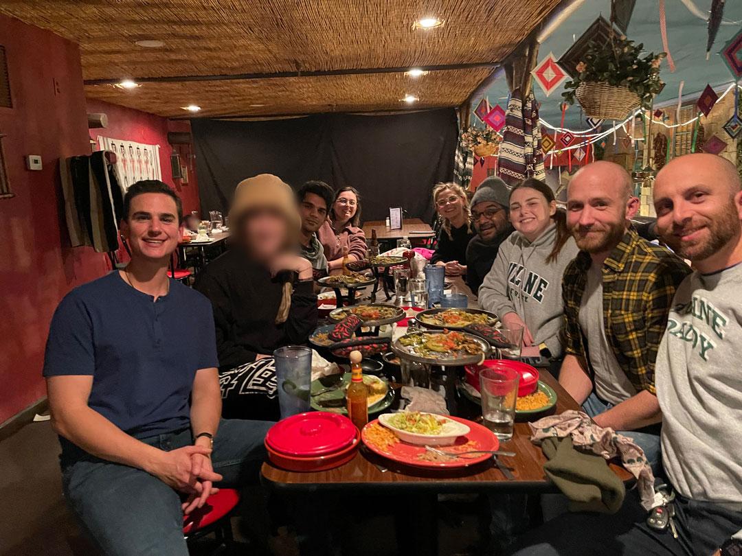 Group photo of TRC members at a restaurant
